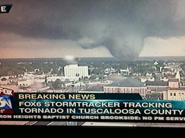 people running away from tornado. tuscaloosa tornado. tornado